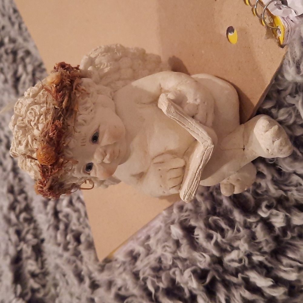Dreamsickle self sitter angel reading a book